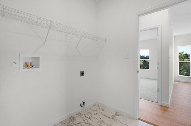 49 Back Ln Unit 49Stb, Washington, MO 63090 - laundry room featuring hookup for an electric dryer, hookup for a washing machine, baseboards, and light marble finish flooring