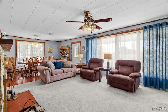living area with carpet flooring and ceiling fan