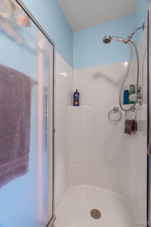 full bathroom with a stall shower