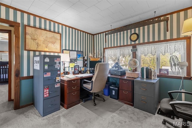 home office with wallpapered walls, light colored carpet, and ornamental molding