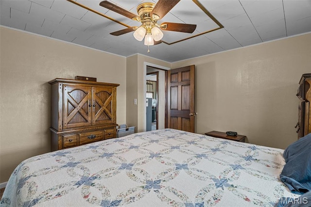 bedroom featuring ornamental molding and ceiling fan