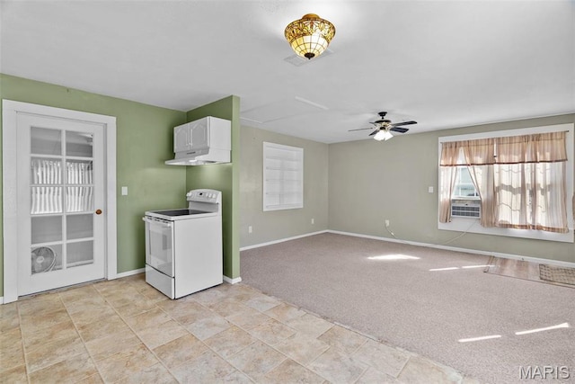 unfurnished living room featuring a ceiling fan, baseboards, light carpet, and light stone finish flooring