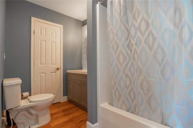 601 Broadway St, Van Buren, MO 63965 - bathroom featuring wood finished floors, toilet, shower / tub combo with curtain, and vanity