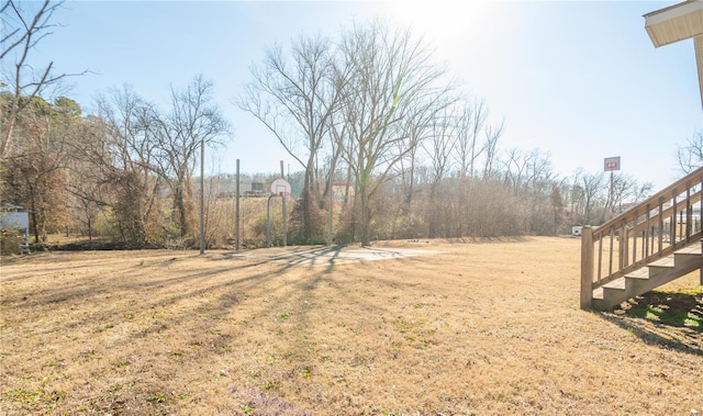 601 Broadway St, Van Buren, MO 63965 - view of green lawn featuring stairway and basketball hoop