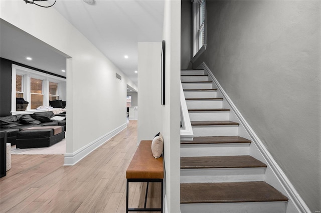 5818 Westminster Pl, Saint Louis, MO 63112 - staircase featuring wood finished floors, baseboards, and recessed lighting