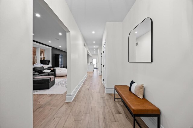 5818 Westminster Pl, Saint Louis, MO 63112 - hall featuring light wood finished floors, recessed lighting, and baseboards