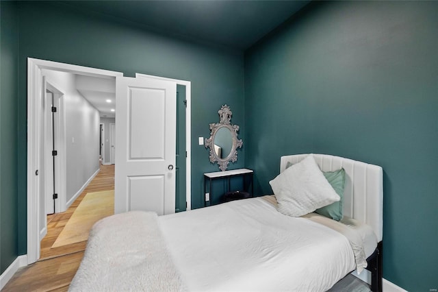 5818 Westminster Pl, Saint Louis, MO 63112 - bedroom featuring baseboards and wood finished floors