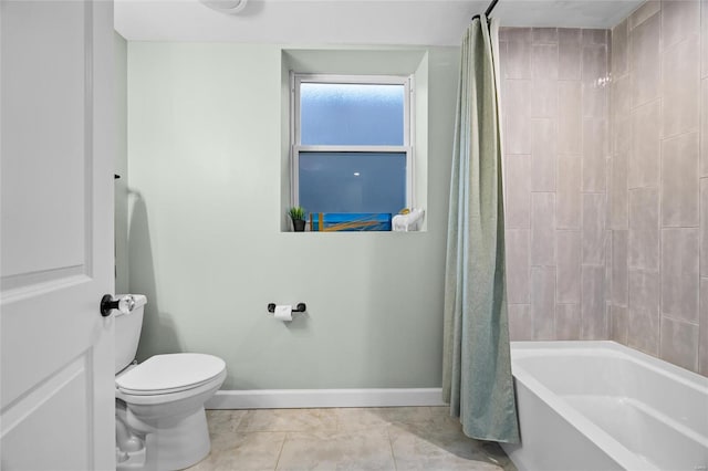 5818 Westminster Pl, Saint Louis, MO 63112 - bathroom featuring baseboards, toilet, shower / bath combo with shower curtain, and tile patterned floors
