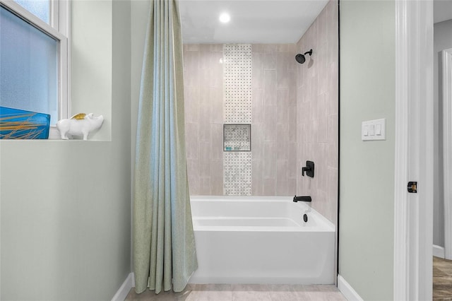 5818 Westminster Pl, Saint Louis, MO 63112 - bathroom with shower / bathtub combination with curtain and baseboards