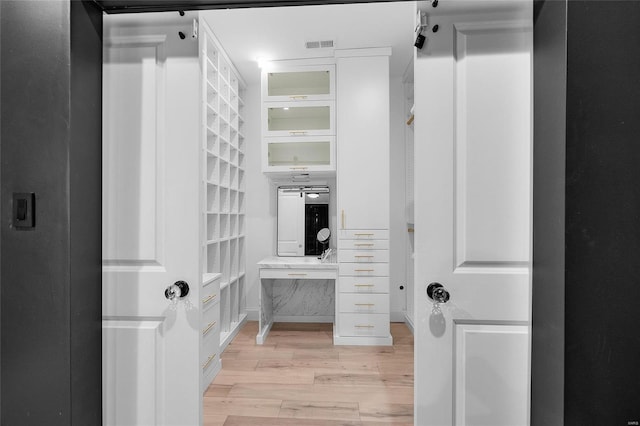 5818 Westminster Pl, Saint Louis, MO 63112 - spacious closet with light wood-type flooring