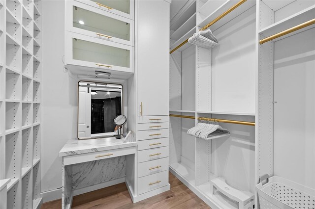 5818 Westminster Pl, Saint Louis, MO 63112 - walk in closet featuring wood finished floors