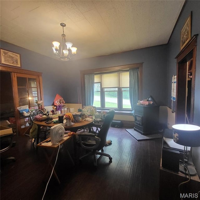808 Walnut St, Doniphan, MO 63935 - dining area featuring wood finished floors, a chandelier, an office area, and a wood stove