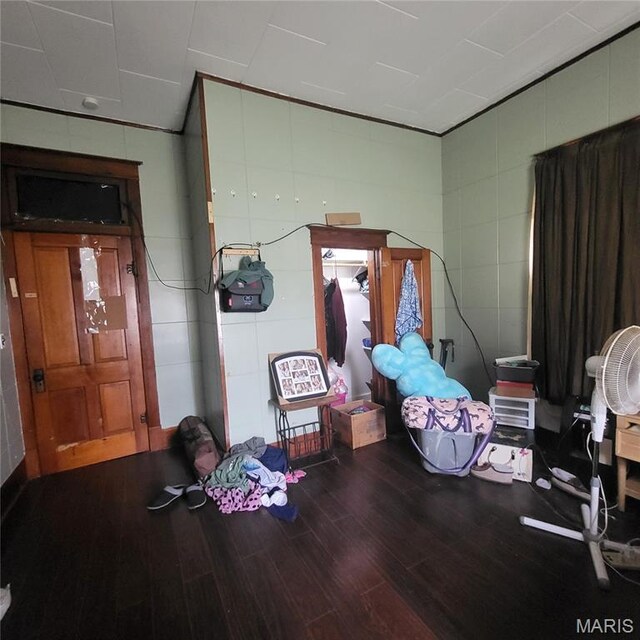 808 Walnut St, Doniphan, MO 63935 - misc room featuring wood finished floors and tile walls
