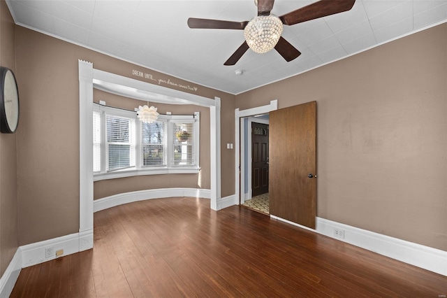 211 E Alton St, Marine, IL 62061 - spare room featuring wood-type flooring, a ceiling fan, a chandelier, and baseboards