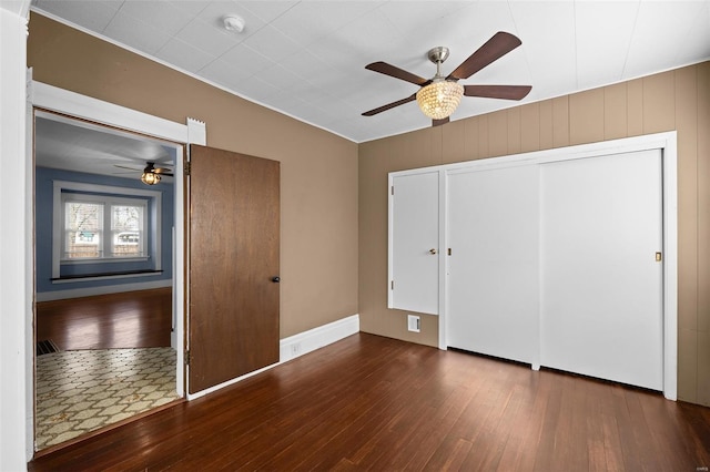 211 E Alton St, Marine, IL 62061 - unfurnished bedroom featuring hardwood / wood-style flooring, a closet, a ceiling fan, and baseboards