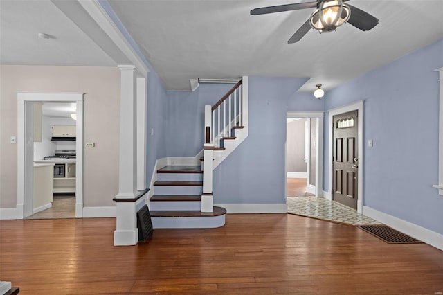 211 E Alton St, Marine, IL 62061 - entryway featuring a ceiling fan, wood-type flooring, stairway, and baseboards