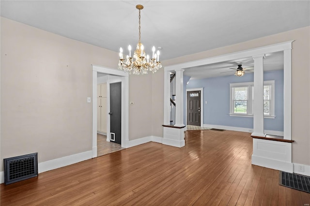 211 E Alton St, Marine, IL 62061 - unfurnished dining area featuring hardwood / wood-style floors, decorative columns, baseboards, and ceiling fan