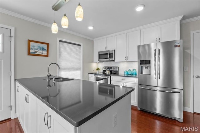 1451 Bella Vista Dr, Jackson, MO 63755 - kitchen with stainless steel appliances, a sink, dark countertops, crown molding, and dark wood-type flooring
