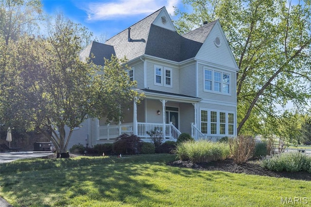 3560 Saint Albans Rd, Saint Albans, MO 63073 - victorian-style house with a porch, a shingled roof, and a front lawn