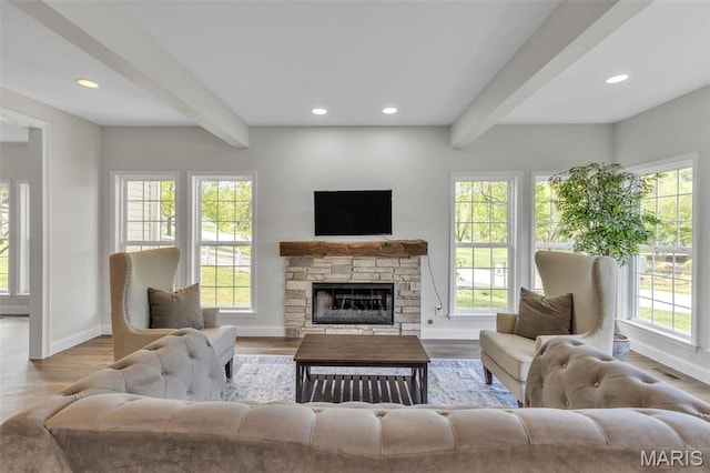 3560 Saint Albans Rd, Saint Albans, MO 63073 - living room featuring beamed ceiling, baseboards, wood finished floors, recessed lighting, and a stone fireplace