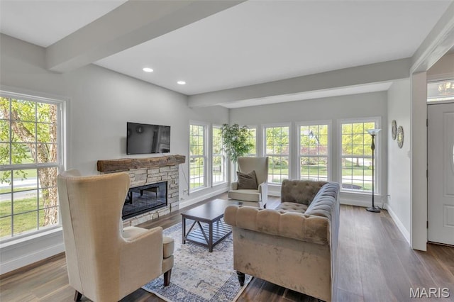 3560 Saint Albans Rd, Saint Albans, MO 63073 - living area featuring baseboards, wood finished floors, recessed lighting, beam ceiling, and a stone fireplace