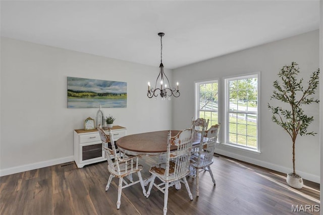 3560 Saint Albans Rd, Saint Albans, MO 63073 - dining area with baseboards, dark wood finished floors, and a chandelier