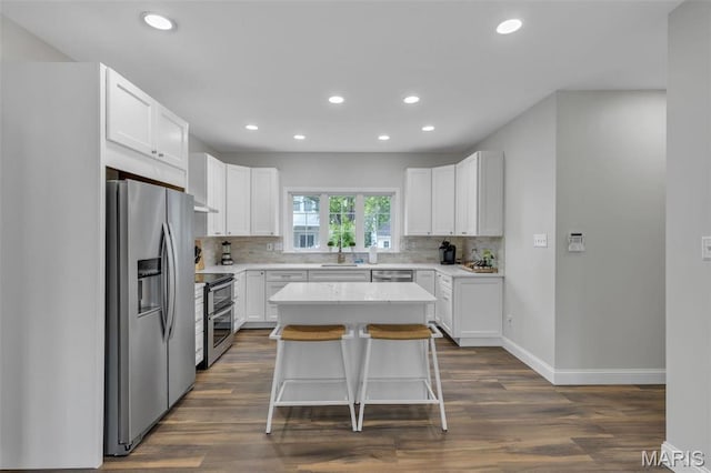 3560 Saint Albans Rd, Saint Albans, MO 63073 - kitchen featuring appliances with stainless steel finishes, recessed lighting, backsplash, a sink, and dark wood-type flooring