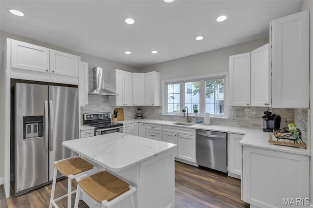 3560 Saint Albans Rd, Saint Albans, MO 63073 - kitchen with appliances with stainless steel finishes, wall chimney range hood, a sink, a kitchen island, and decorative backsplash