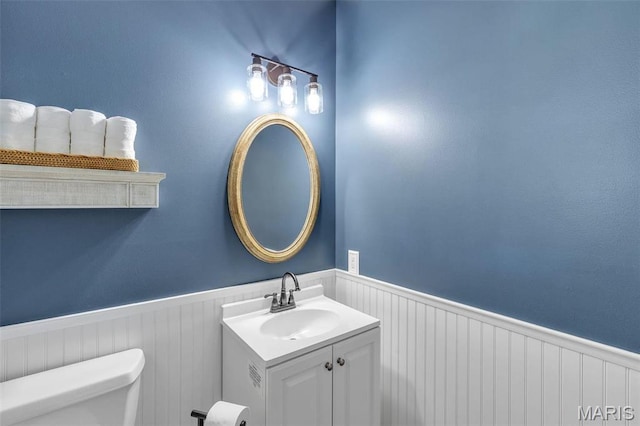 3560 Saint Albans Rd, Saint Albans, MO 63073 - bathroom featuring a wainscoted wall, toilet, and vanity