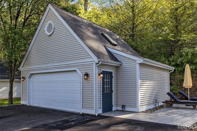 3560 Saint Albans Rd, Saint Albans, MO 63073 - garage featuring asphalt driveway