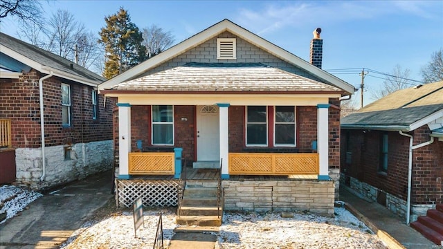 3722 Neosho St, Saint Louis, MO 63116 - view of front of property with a porch, a chimney, and a shingled roof