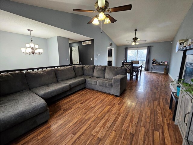 19782 Sugar Ln, Waynesville, MO 65583 - living area featuring a chandelier, a ceiling fan, wood finished floors, high vaulted ceiling, and baseboards