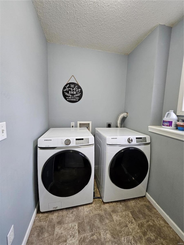 19782 Sugar Ln, Waynesville, MO 65583 - clothes washing area with separate washer and dryer, baseboards, and a textured ceiling