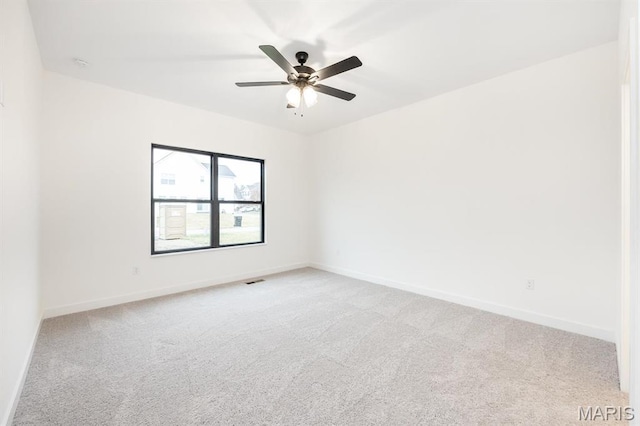 905 Montebello Ln, Ofallon, IL 62269 - empty room featuring light carpet, baseboards, and a ceiling fan