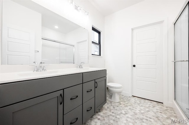 905 Montebello Ln, Ofallon, IL 62269 - bathroom featuring a shower stall, toilet, and double vanity