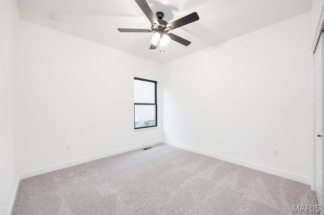 905 Montebello Ln, Ofallon, IL 62269 - spare room with light carpet, baseboards, and a ceiling fan