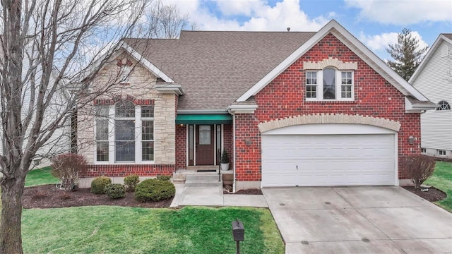 view of front of house with brick siding, driveway, roof with shingles, a garage, and a front yard