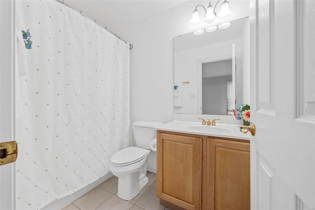 bathroom with tile patterned floors, toilet, vanity, and a shower with curtain