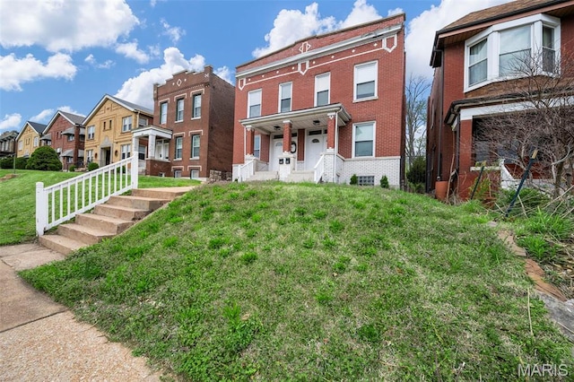 3801 Potomac St, Saint Louis, MO 63116 - multi unit property featuring brick siding, a residential view, a porch, and a front lawn