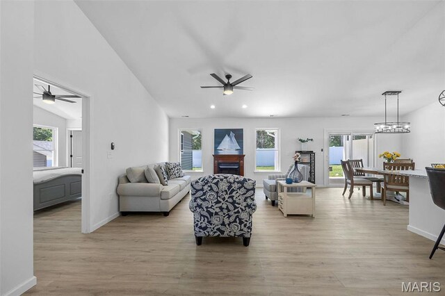 1569 Hickory Lndg, De Soto, MO 63020 - living area featuring ceiling fan, light wood finished floors, a fireplace, baseboards, and recessed lighting