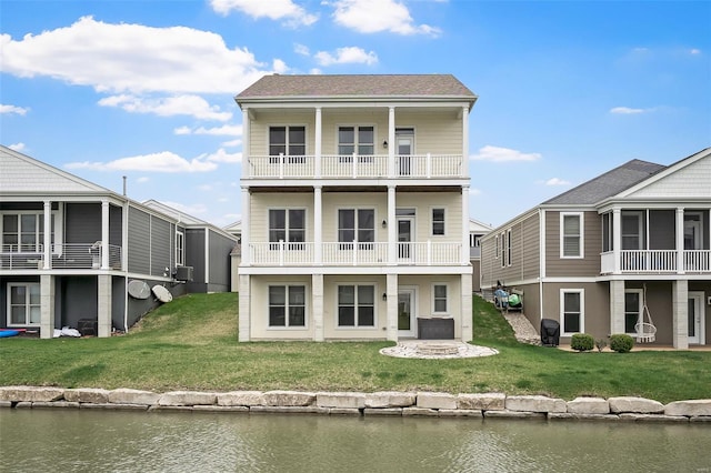 4036 Hempstead St, Saint Charles, MO 63301 - back of house featuring a balcony, a yard, a water view, and an outdoor fire pit