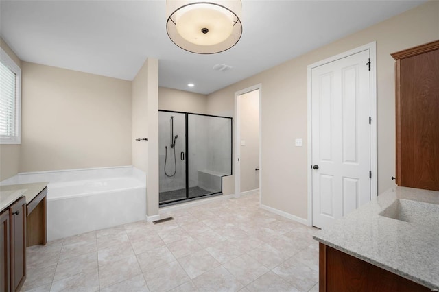 4036 Hempstead St, Saint Charles, MO 63301 - full bath featuring vanity, a shower stall, a bath, tile patterned flooring, and recessed lighting
