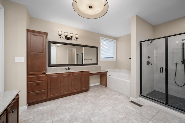 4036 Hempstead St, Saint Charles, MO 63301 - bathroom with a shower stall, vanity, a garden tub, and tile patterned floors