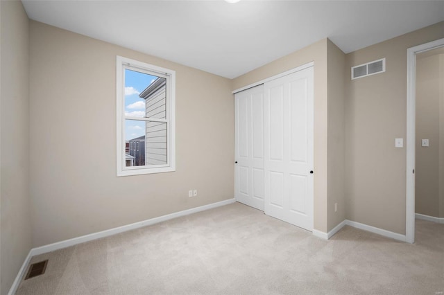 4036 Hempstead St, Saint Charles, MO 63301 - unfurnished bedroom with light carpet, a closet, and baseboards
