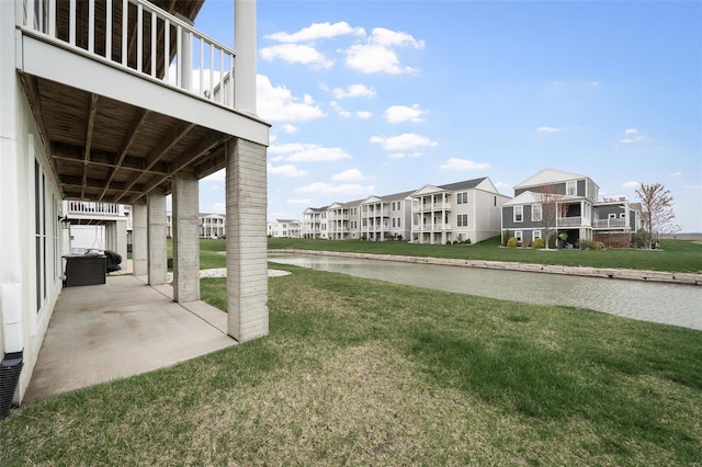 4036 Hempstead St, Saint Charles, MO 63301 - view of green lawn featuring a patio area, a residential view, and a water view