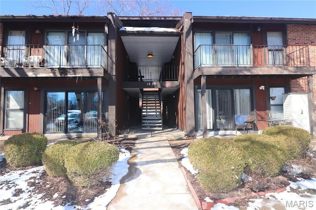 1090 Mersey Bend Dr Unit F, Saint Louis, MO 63129 - snow covered building with stairs