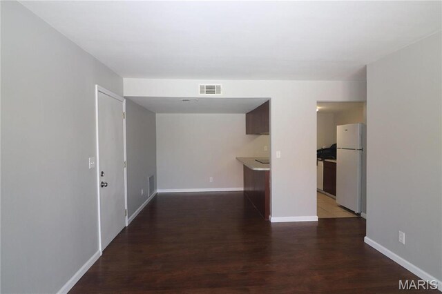 1090 Mersey Bend Dr Unit F, Saint Louis, MO 63129 - spare room featuring baseboards and wood finished floors