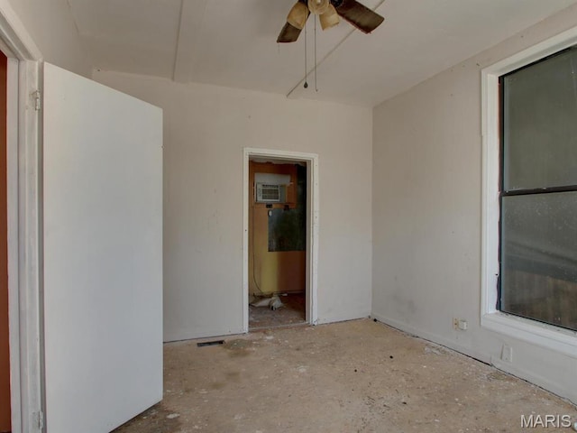 1700 Chestnut, Hannibal, MO 63401 - spare room featuring a ceiling fan and an AC wall unit