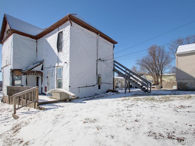 1700 Chestnut, Hannibal, MO 63401 - snow covered rear of property with stairway