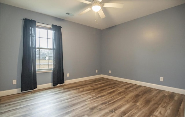 12 Paradise St, Benton, MO 63736 - empty room featuring wood finished floors, baseboards, and a ceiling fan